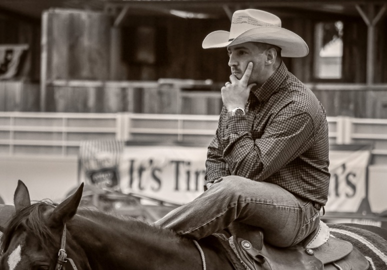 Rodeo cowboy sitting